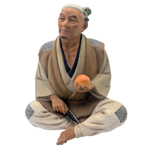 Vintage Man Slicing Orange Japanese Hakata Doll