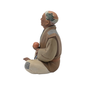 Vintage Man Slicing Orange Japanese Hakata Doll