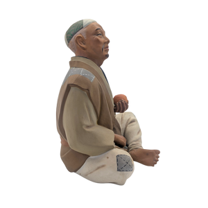 Vintage Man Slicing Orange Japanese Hakata Doll