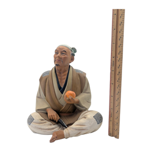 Vintage Man Slicing Orange Japanese Hakata Doll